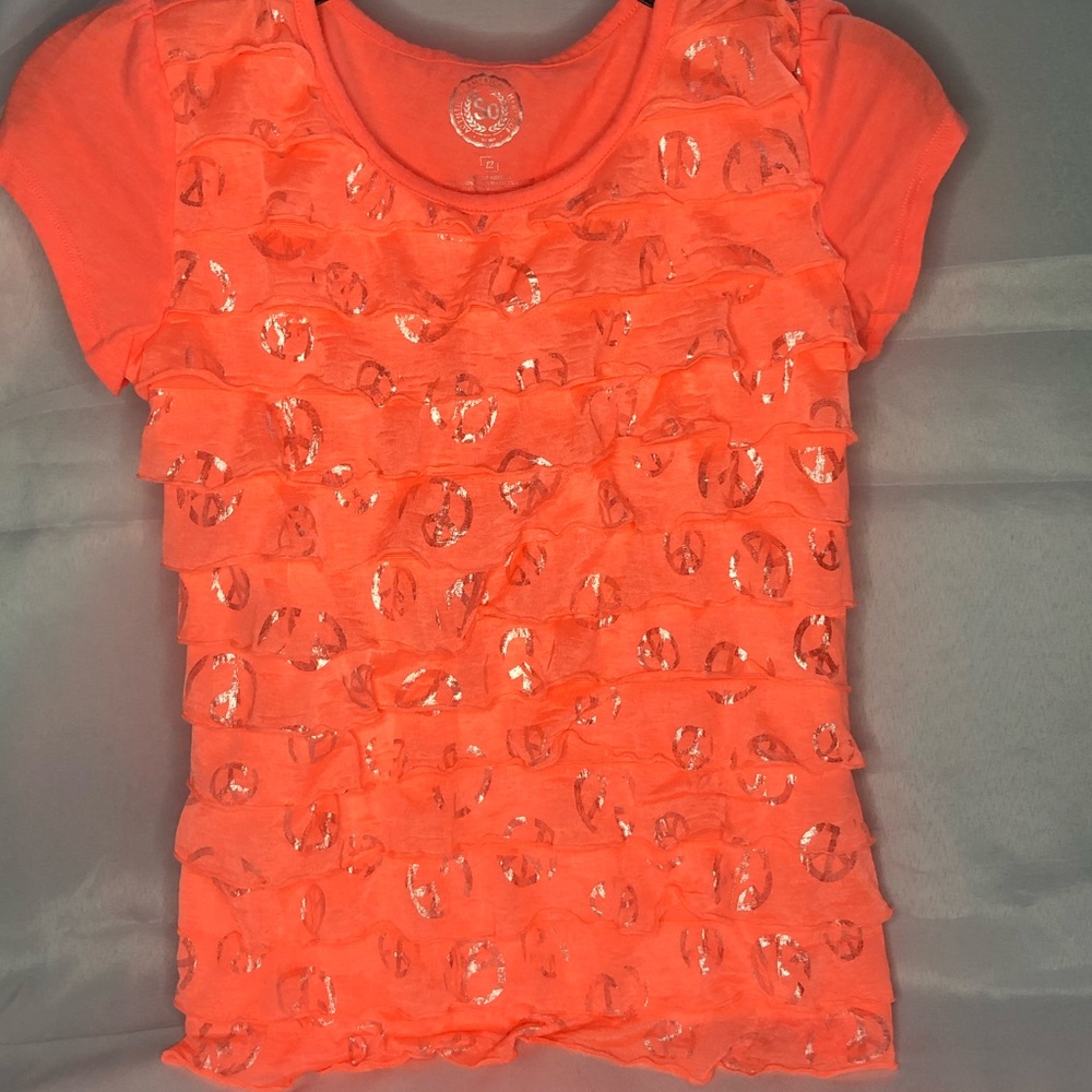 Bright peach/reddish Orange shirt with silver flap designs